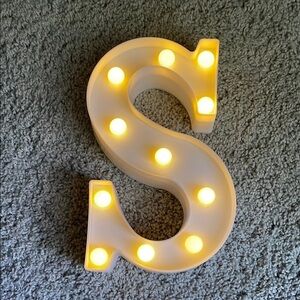 Illuminated White Letter 'S' Marquee Light